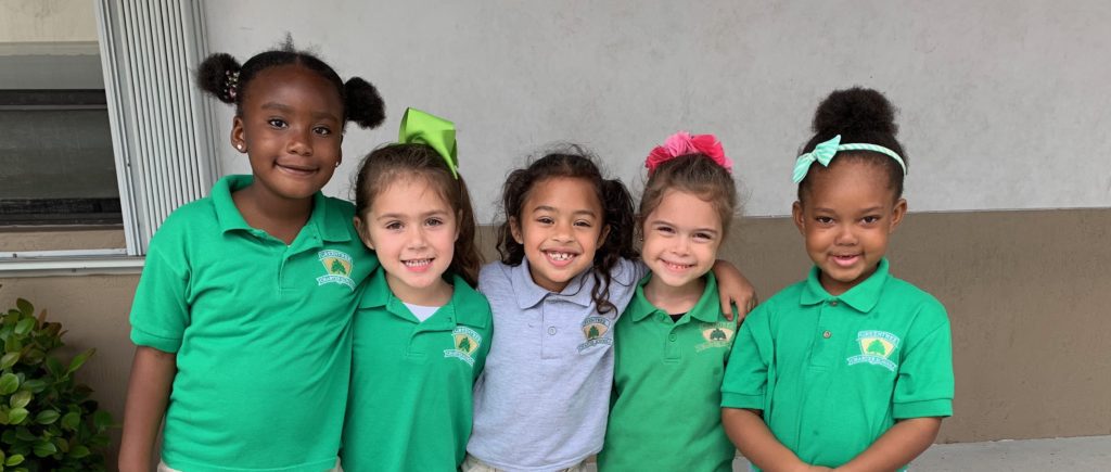 A row of smiling elementary students