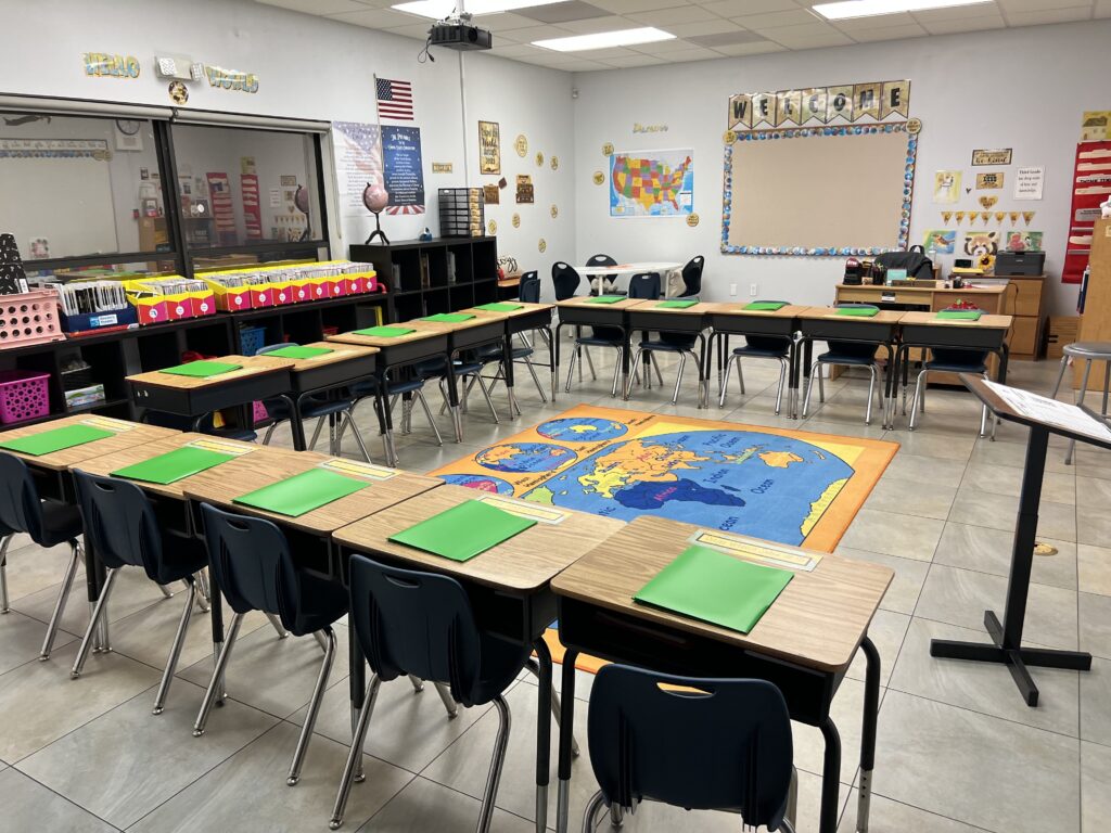 A kindergarten classroom with a colorful rug